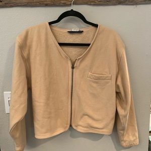 Pinkish/ salmon cardigan.